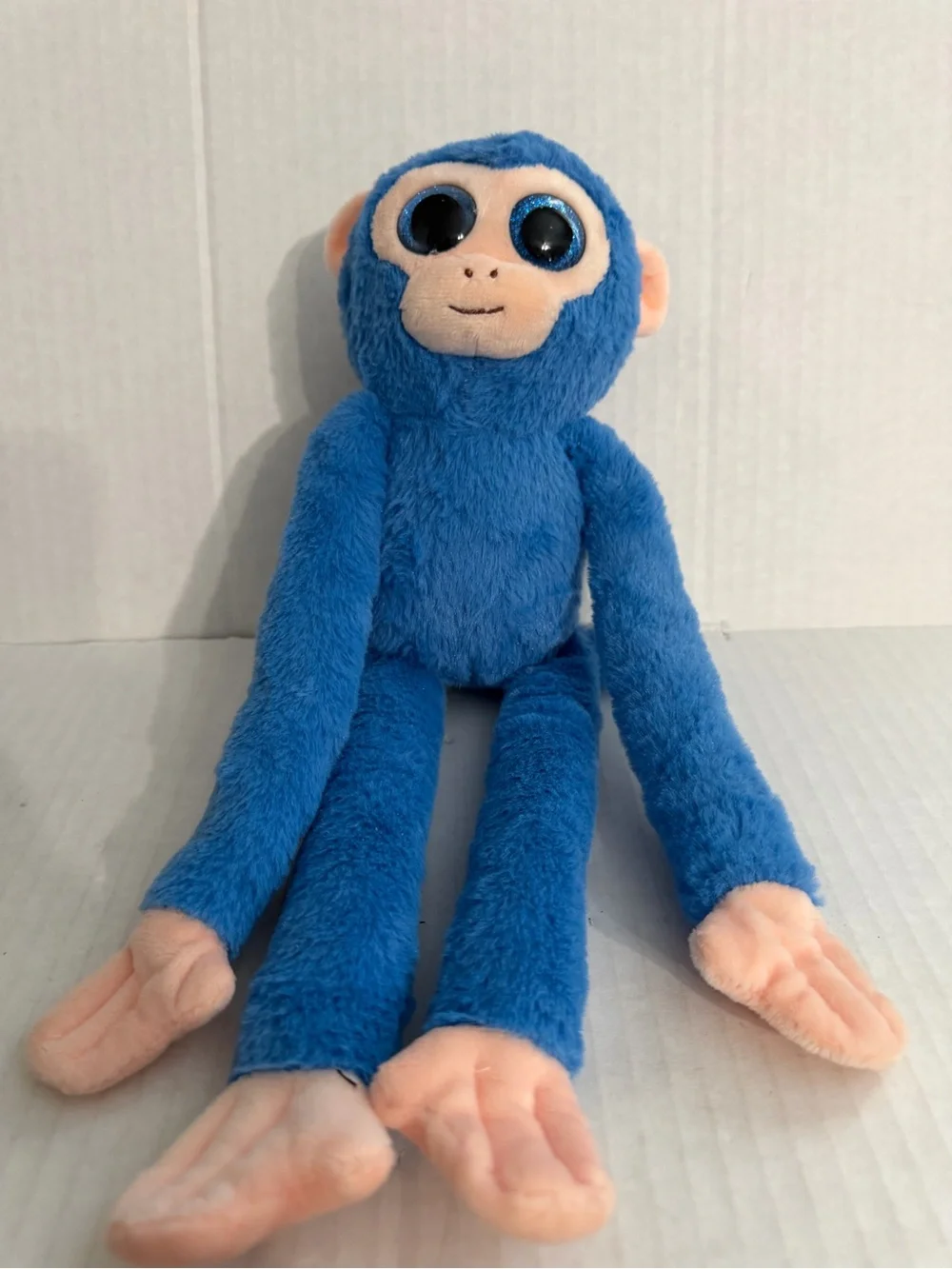 US Fun Machines Glitter Eyes Blue Spider Monkey Plush